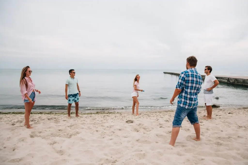 Family walking together on a sandy beach