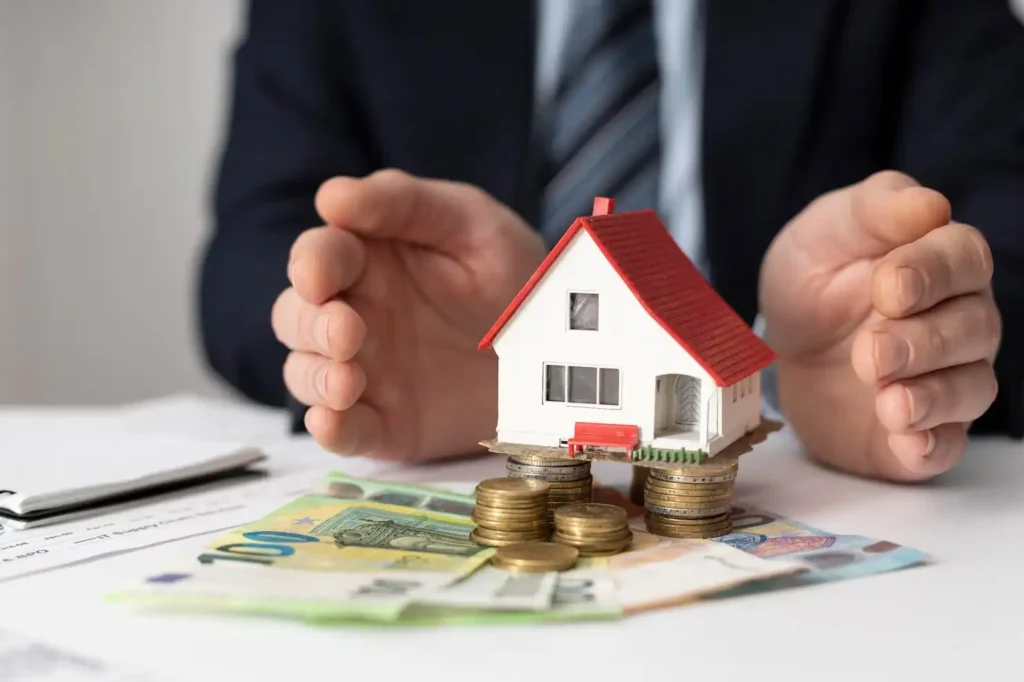Secure property investment in Costa Rica, with hands protecting a model house, coins, and documents.