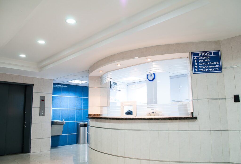 Modern hospital entrance in Costa Rica, comparing public Caja and private healthcare options for expats