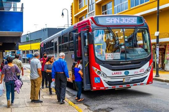 San José city bus Route 210 La Red at a busy stop in Costa Rica