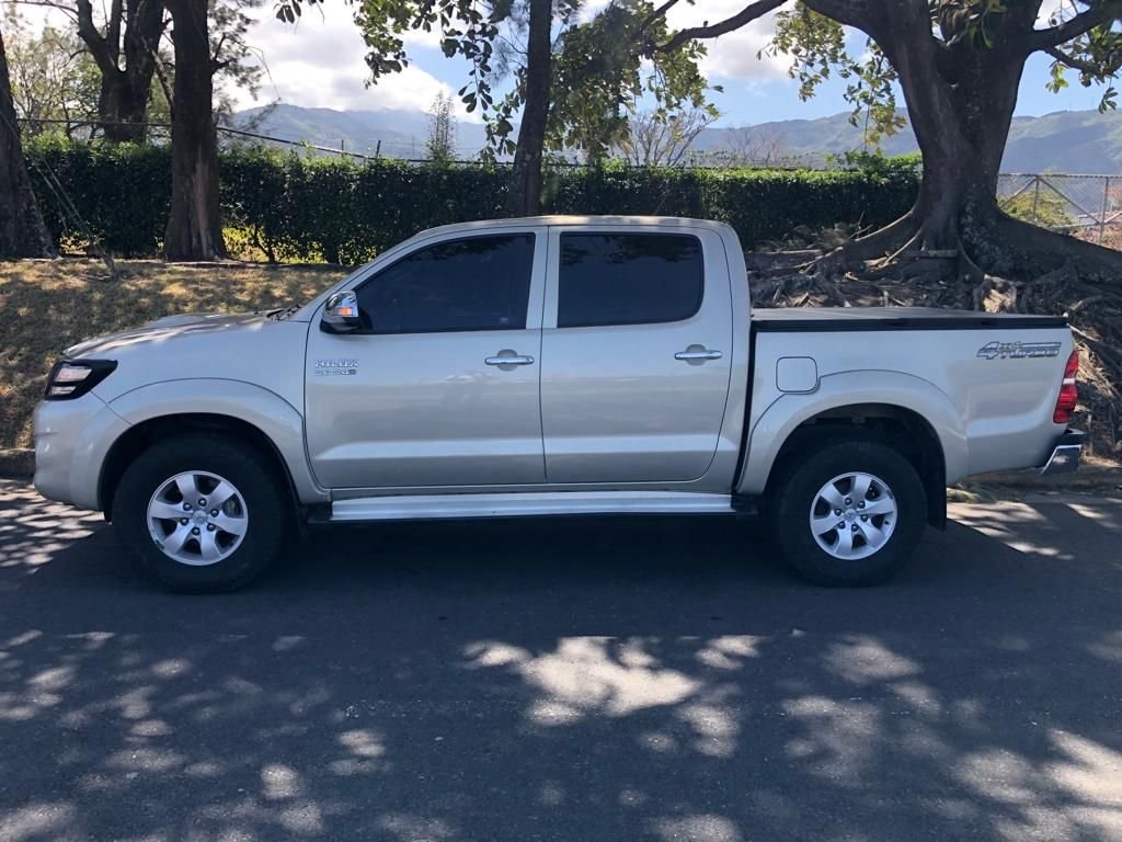 Silver Toyota Hilux double-cab pickup parked outdoors