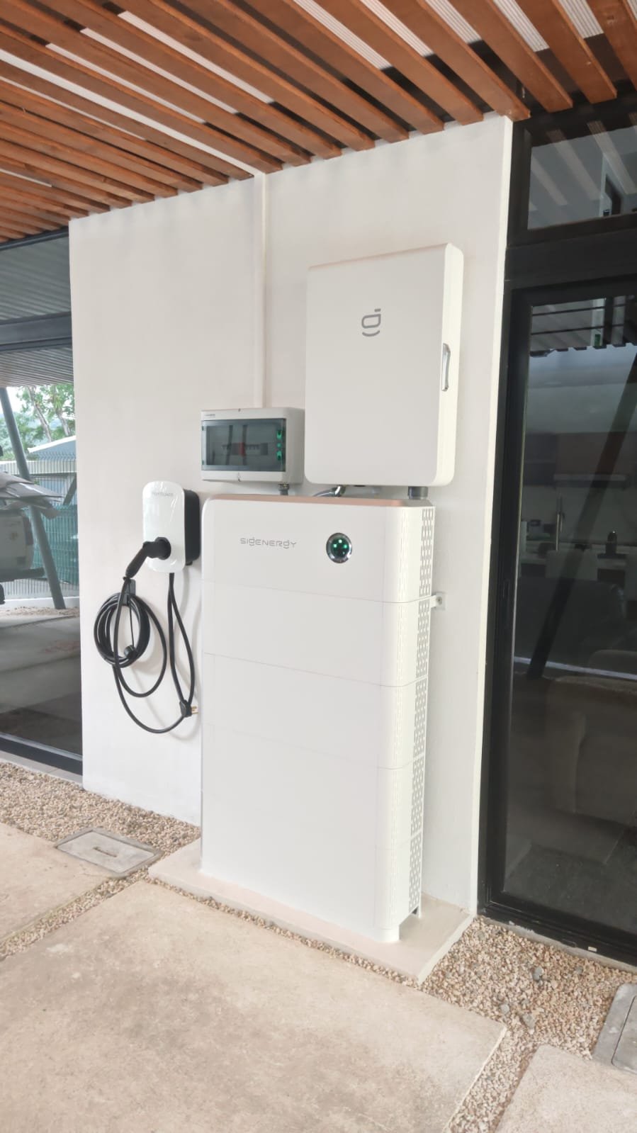 Illustrative solar equipment and a car charger mounted at an IntiTech installation